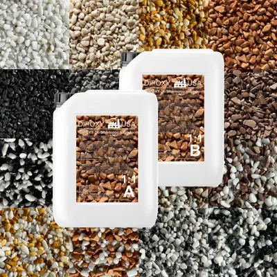 Two white plastic containers of epoxy resin are placed in the center of the image, surrounded by a collage of different colored gravel and stone aggregates. The containers have labels with product information and images of the gravel.