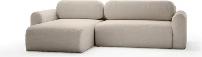 A beige sectional sofa is shown against a white background.