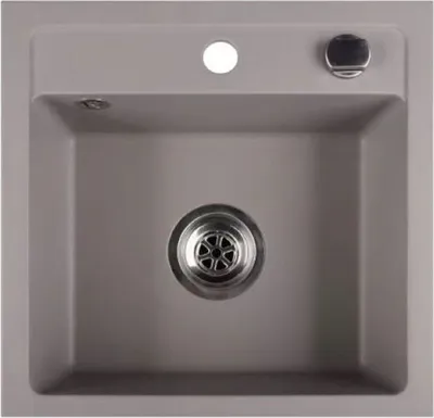 A top-down view of a gray kitchen sink with a drain in the center and a faucet hole and a control knob on the rim.