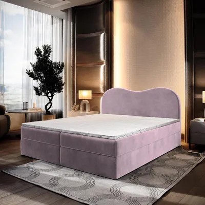 A bedroom setting with a bed as the main focus.