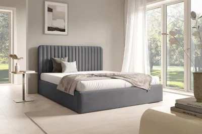 A bedroom scene with a bed, nightstand, and window.