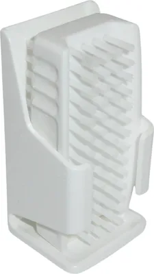 A white handwash brush with a holder.