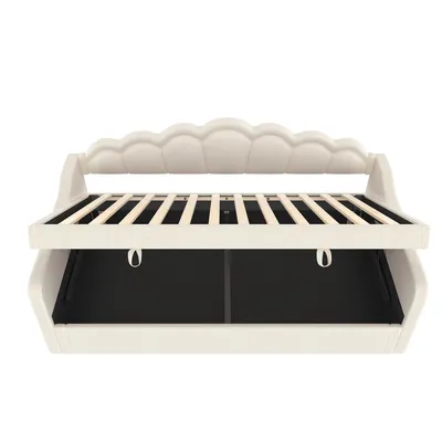 A cream-colored sofa bed with its mattress support slats visible.
