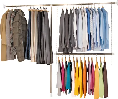 A clothing rack with various garments hanging on it.