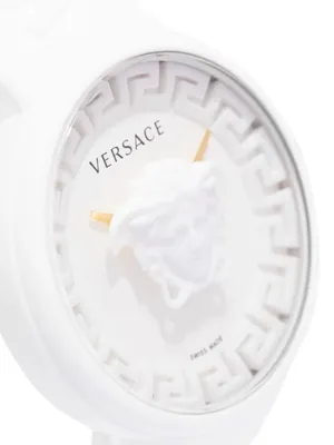 A close-up, studio shot of a white Versace watch.