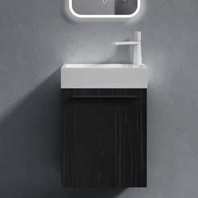 A modern bathroom vanity set with a black wood-grain cabinet and a white sink, mounted on a gray textured wall.