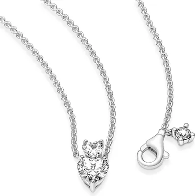 A silver necklace with two heart-shaped clear stones, presented on a white background.