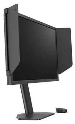 A black computer monitor with side shields on a black stand, with a small black device in the foreground.