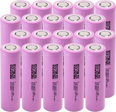 A group of pink rechargeable batteries arranged in rows.