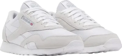 A pair of white Reebok Classic Nylon sneakers.