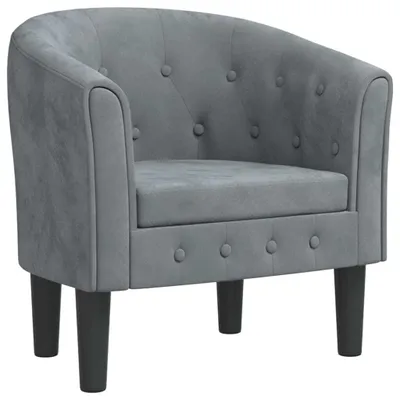 A studio shot of a gray velvet armchair.