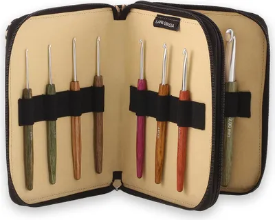 An open crochet hook case with multiple crochet hooks inside.
