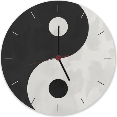 A yin and yang clock with black and white sections and clock hands.