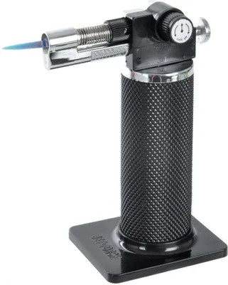A butane torch with a blue flame is shown against a white background.