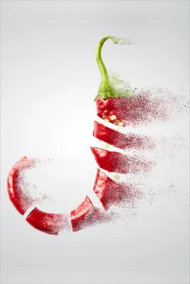Produktbild von Wallario Poster - Chilischote löst sich in Pulver auf, Kunstdruck Größe: 61 x 91,50 cm