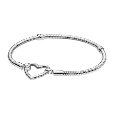 A silver Pandora bracelet with a heart-shaped clasp is displayed against a white background.