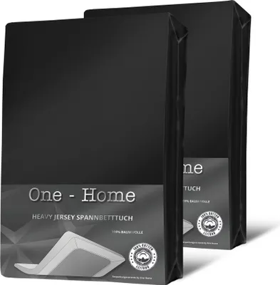 Two black packaged bed sheets are shown in a studio setting.