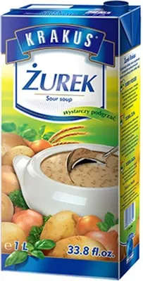 A carton of Krakus Zurek sour soup with ingredients like potatoes and onions depicted around it.
