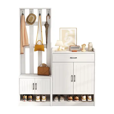 A white entryway furniture set with a coat rack, shoe cabinets, and decorative items on top.