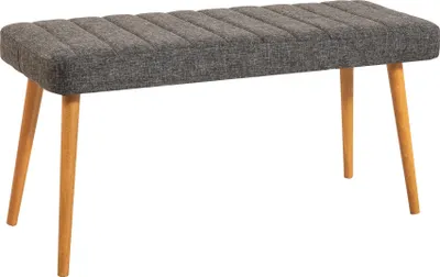 A gray upholstered bench with wooden legs on a white background.