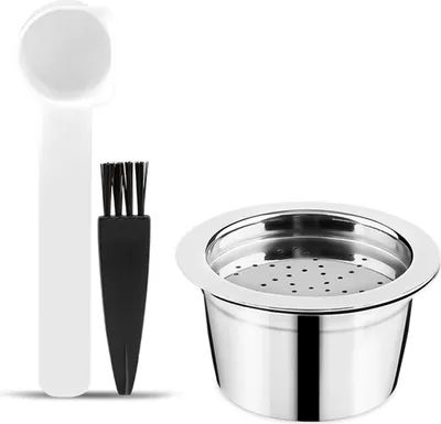 A set of reusable coffee capsules with a scoop and brush.