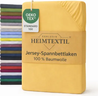A stack of folded fitted sheets in various colors, with a yellow fitted sheet prominently displayed in the foreground with product information.