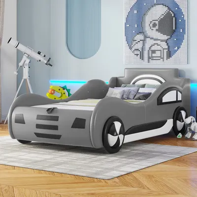 A child's bedroom with a car-shaped bed.