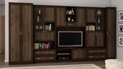 A large, dark wood entertainment center with multiple cabinets, shelves, and drawers, featuring a television in the center.