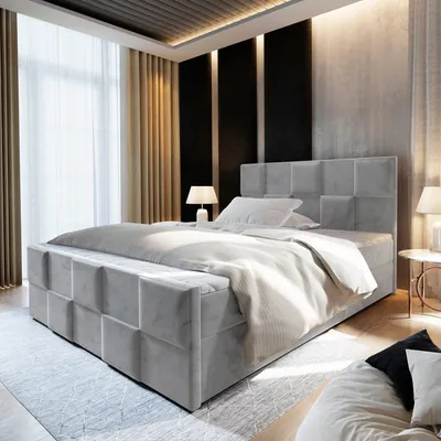 A modern bedroom with a large bed, bedside tables, and curtains.