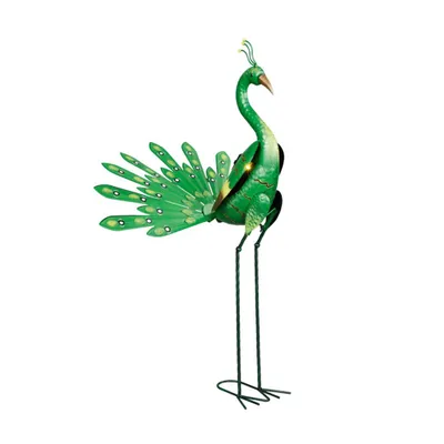 A decorative metal peacock sculpture with its tail feathers fanned out, standing on thin legs.