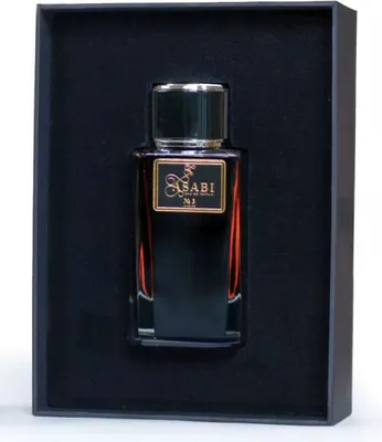 A bottle of perfume is presented in a black box.