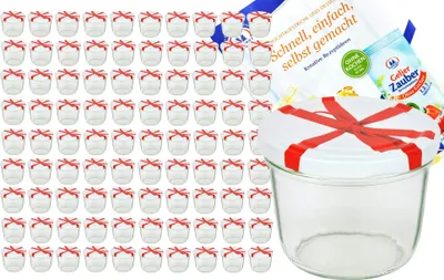 A set of small glass jars with red ribbon decorations and a recipe booklet.