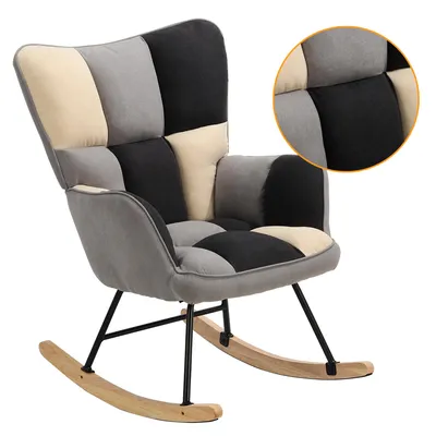 A patchwork rocking chair with armrests against a white background.
