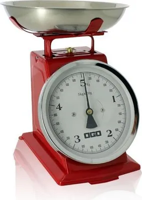 A red retro-style kitchen scale with a silver bowl and a dial.