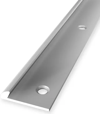 A close-up, angled view of a silver metal profile strip with two pre-drilled holes, set against a white background.