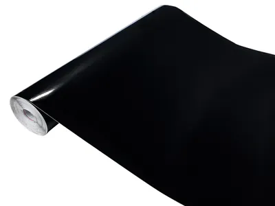 A roll of black glossy vinyl film on a white background.