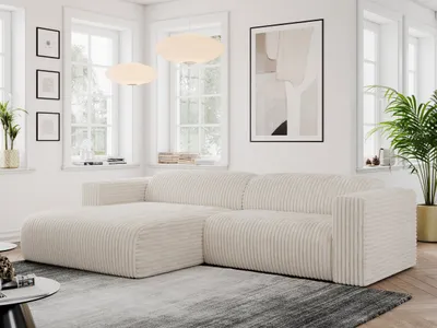 A modern living room with a large beige corduroy sectional sofa.
