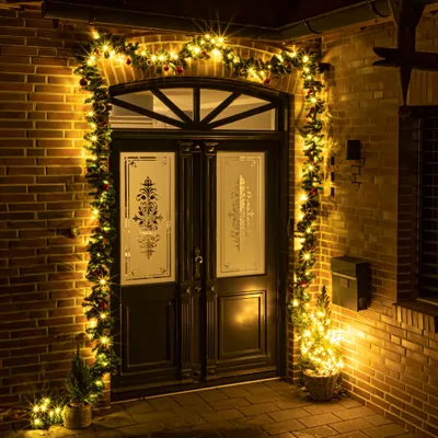 Immagine prodotto di Ghirlanda natalizia con luci fiabesche e decorazioni per albero di Natale - verde / 5 m - Ghirlanda di abete artificiale illuminata in bianco caldo per esterni