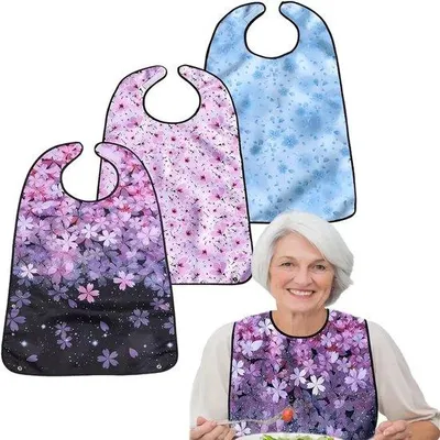 Produktbild von Ultiluxe Lätzchen mit Blumen - 3 Stück - Große Lätzchen für Damen und Herren - Seniorenpflege - Klettverschluss - Pflege - Waschbar - Wasserabweisend