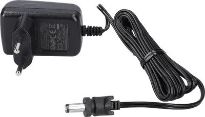 A black AC/DC power adapter with a European plug and a coiled cable with a connector.