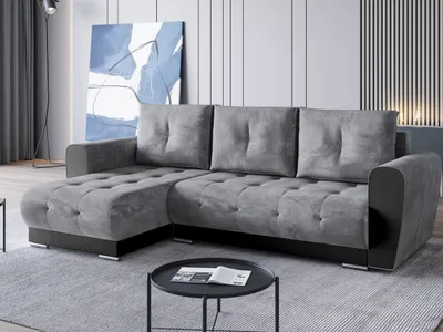 A modern gray sectional sofa is shown in a living room setting.