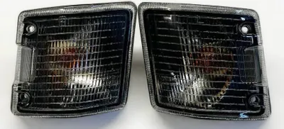 Immagine prodotto di Indicatori di direzione anteriori SINISTRI + DESTRI con presa di corrente in nero per VW T3 Bus da