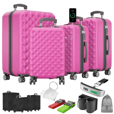 A collection of pink suitcases and travel accessories displayed on a white background.