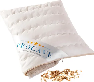 A white quilted pillow with a label and a pile of grain.