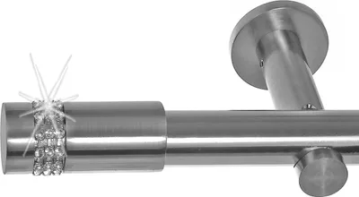 Close-up of a curtain rod with decorative elements.