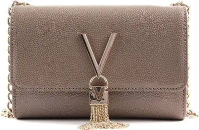 A close-up studio shot of a beige Valentino shoulder bag with gold chain strap and tassel detail.