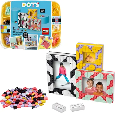 A collection of LEGO DOTS picture frames and loose building tiles, with a box showing the product.