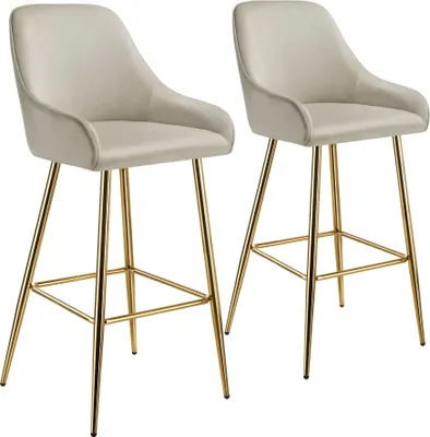 Two beige bar stools with gold legs are shown against a white background.