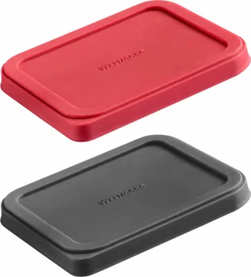 Two rectangular lids, one red and one black, are shown from a slightly elevated angle against a white background.