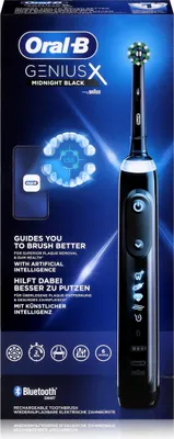 The image shows the packaging of an Oral-B electric toothbrush, with the product itself partially visible.